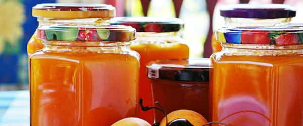Glass jars of fruit preserves